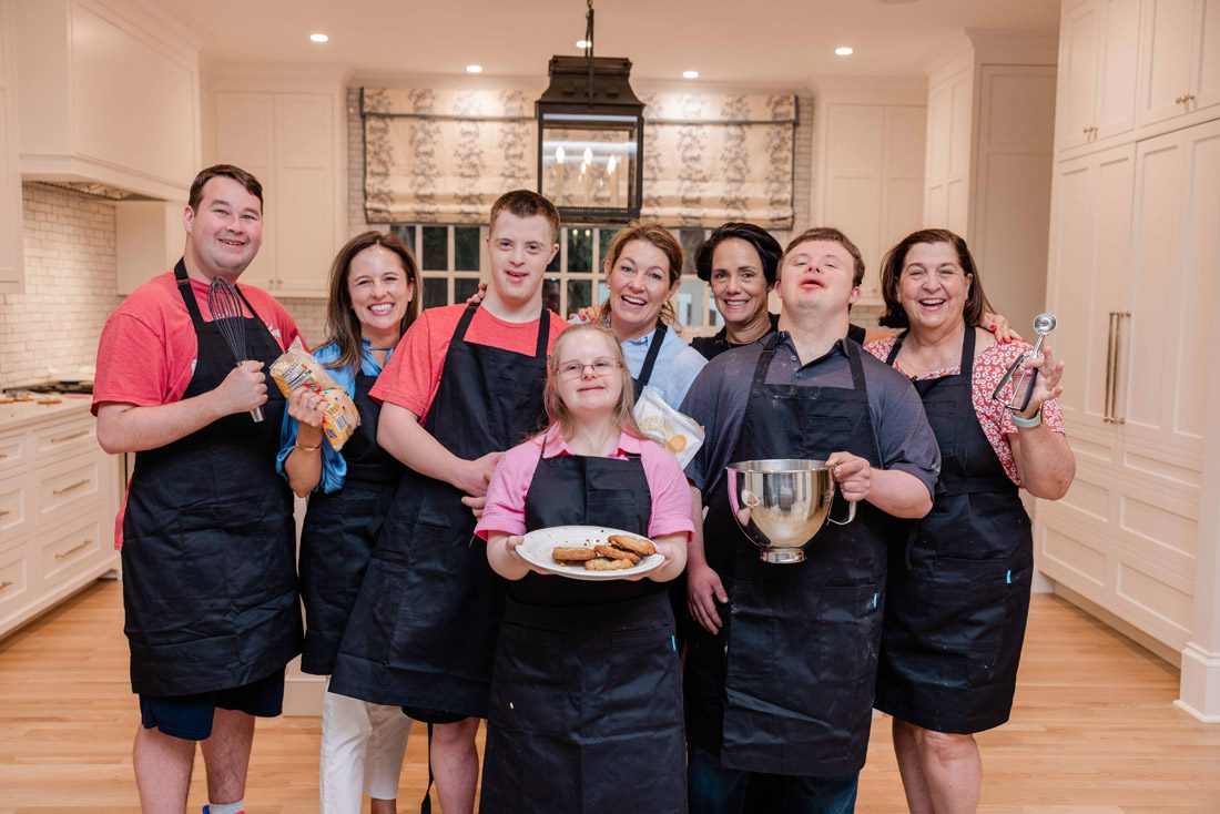 Wondermakers, co-founders and volunteers show off a batch of cookies.